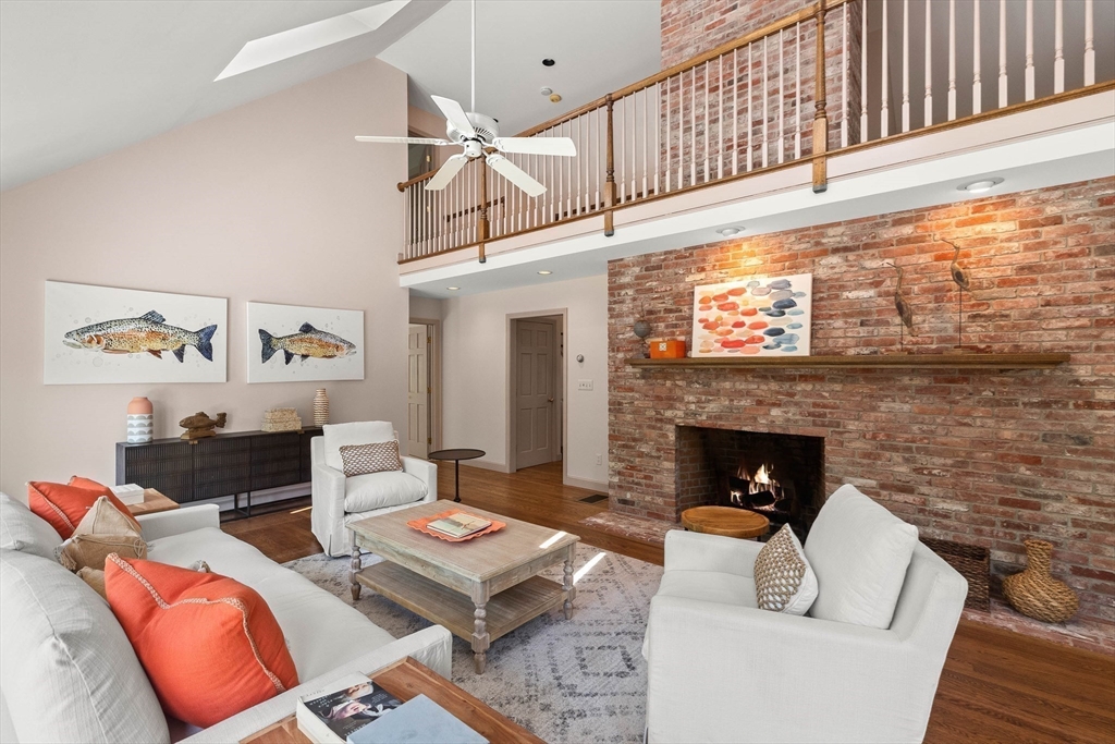 25 Dana Road Boxford, MA 01921 - Photo 15 of 41 a living room with furniture and a fireplace