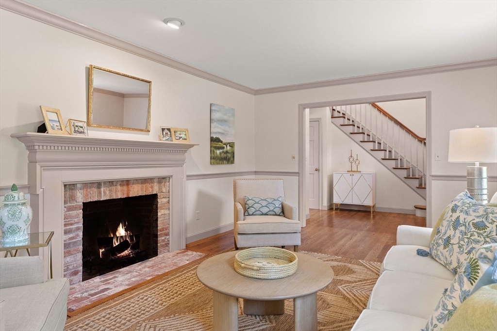 25 Dana Road Boxford, MA 01921 - Photo 17 of 41 a living room with furniture a fireplace and a table