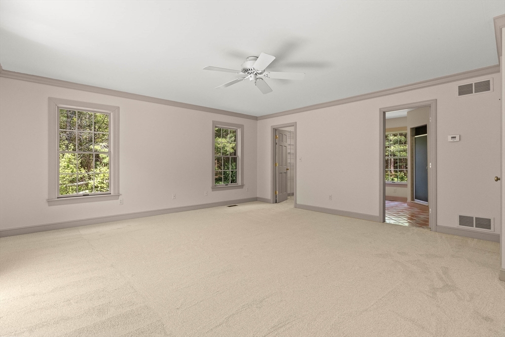 25 Dana Road Boxford, MA 01921 - Photo 20 of 41 an empty room with windows and fan