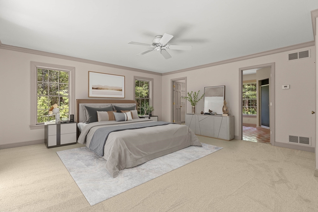 25 Dana Road Boxford, MA 01921 - Photo 21 of 41 a spacious bedroom with a large bed and a chandelier