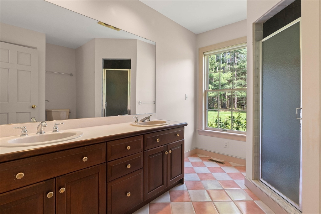25 Dana Road Boxford, MA 01921 - Photo 22 of 41 a spacious bathroom with a granite countertop sink a mirror and a