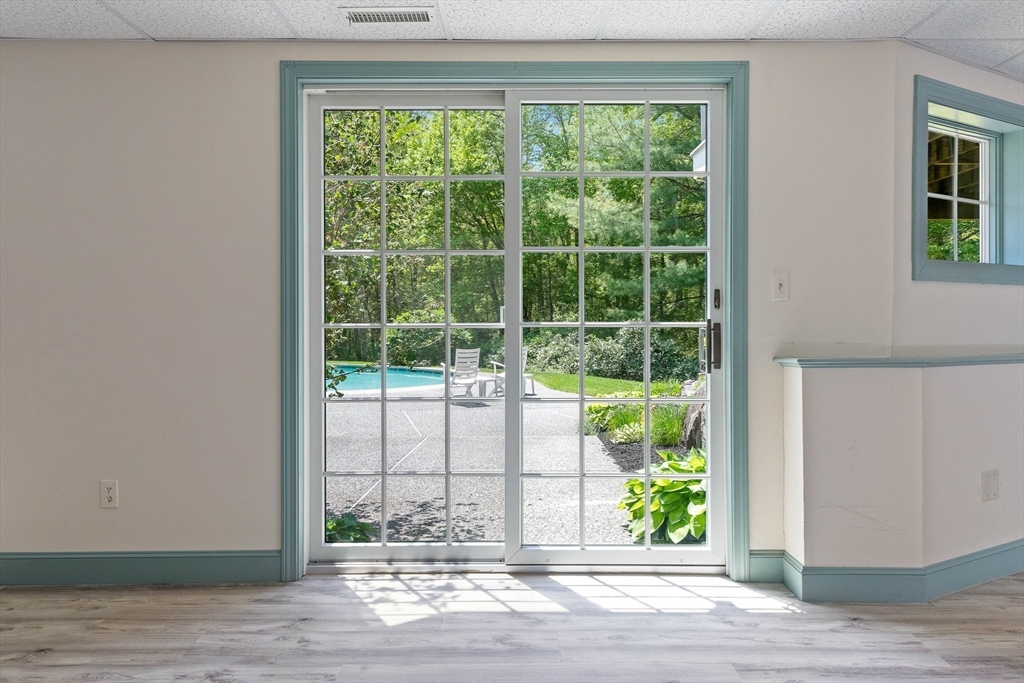 25 Dana Road Boxford, MA 01921 - Photo 35 of 41 a view of empty room with wooden floor and a window