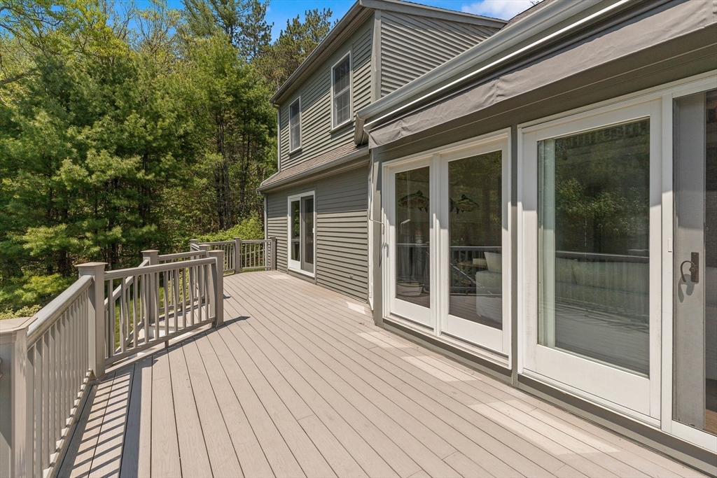 25 Dana Road Boxford, MA 01921 - Photo 37 of 41 a balcony with wooden floor and glass door