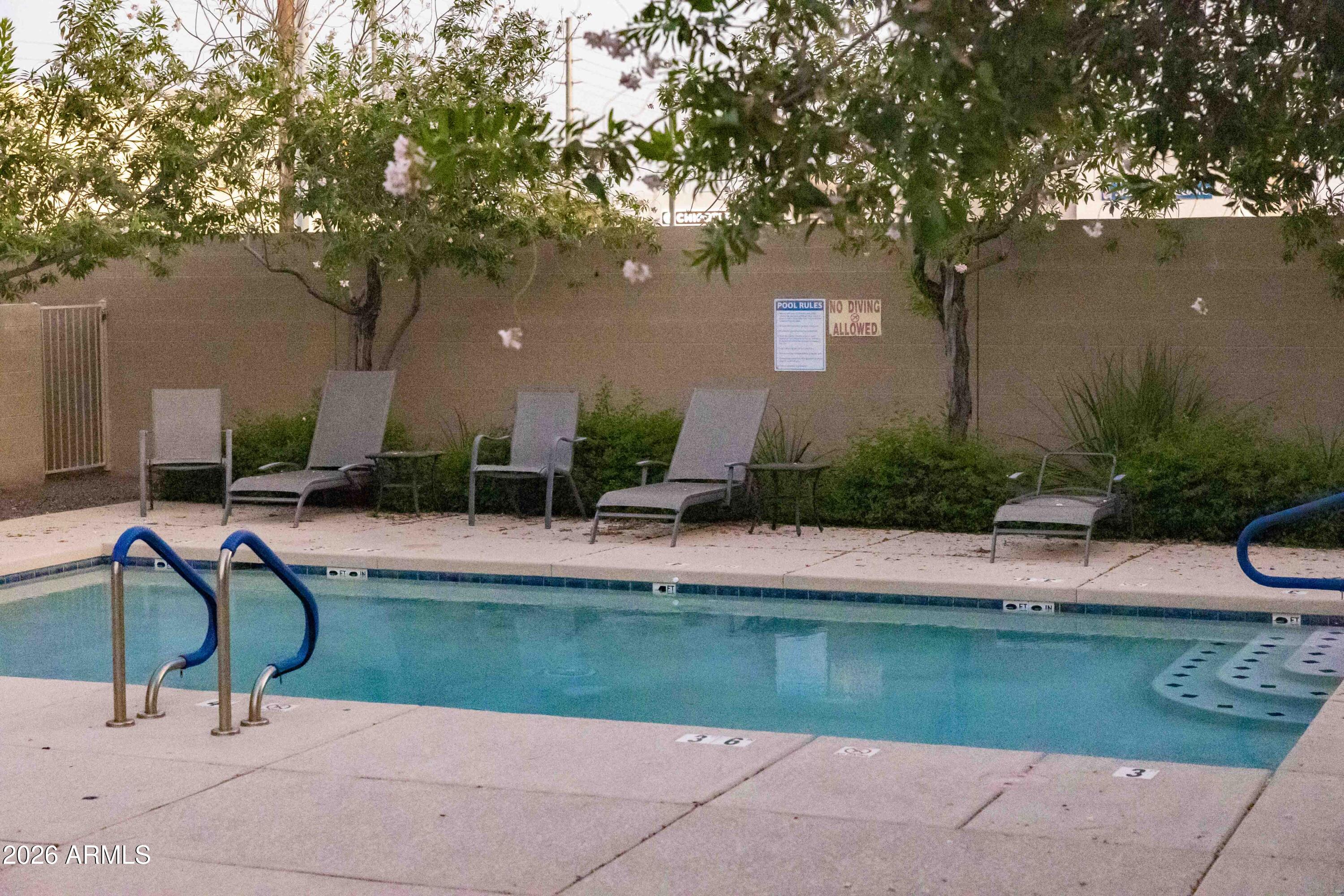 3113 East Danbury Road, Unit 22 Phoenix, AZ 85032 - Photo 17 of 17 a view of swimming pool and patio