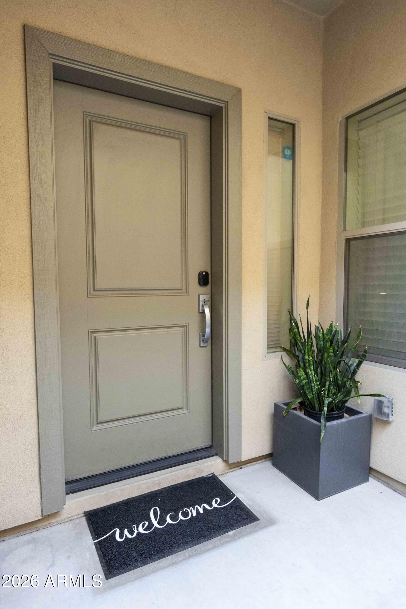 3113 East Danbury Road, Unit 22 Phoenix, AZ 85032 - Photo 2 of 17 a living room with a potted plant