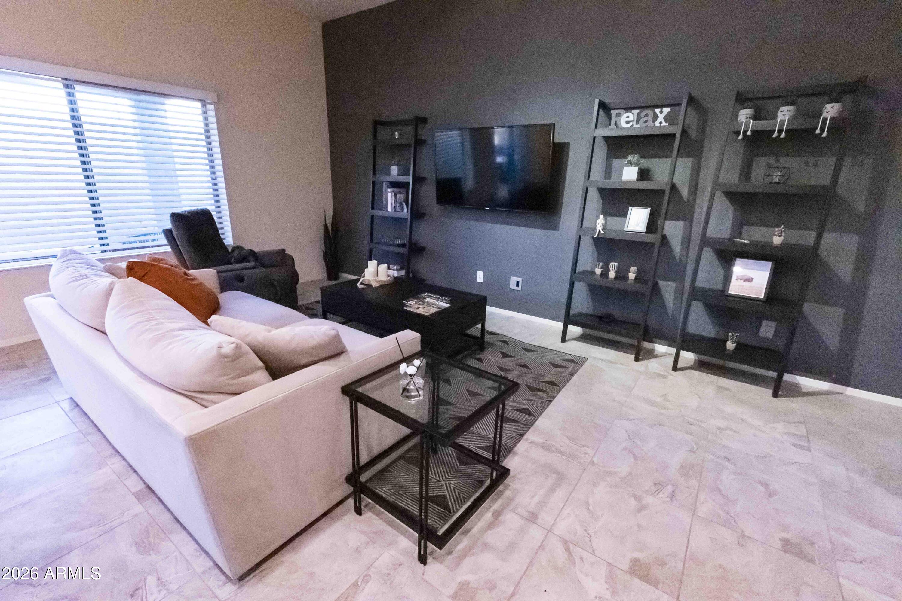 3113 East Danbury Road, Unit 22 Phoenix, AZ 85032 - Photo 4 of 17 a living room with furniture
