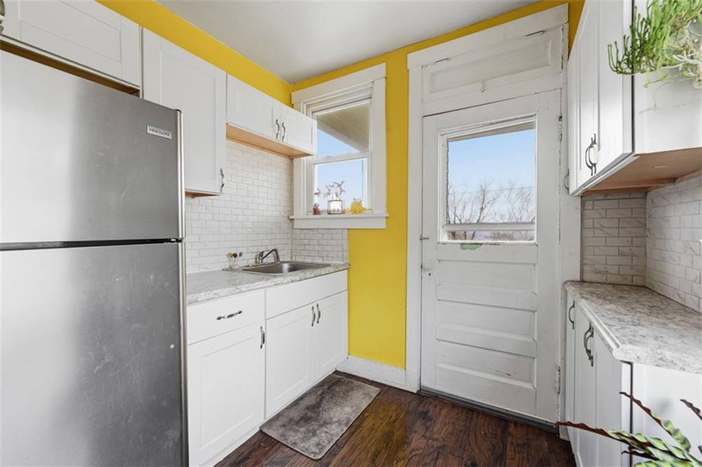 1414 Brinton Road Pittsburgh, PA 15221 - Photo 11 of 20 a kitchen with a refrigerator and sink