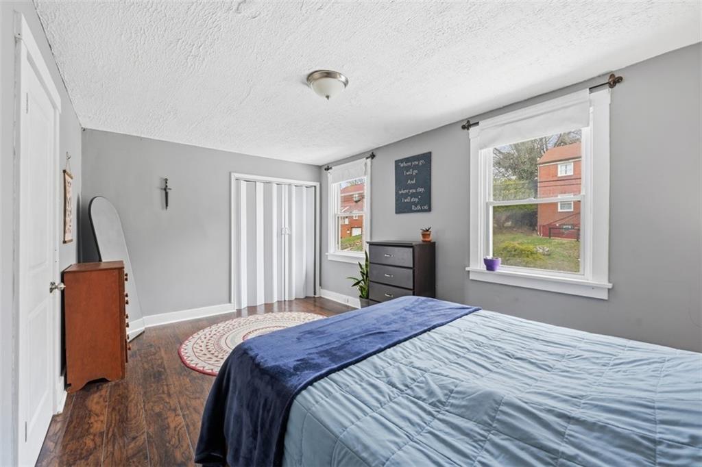 1414 Brinton Road Pittsburgh, PA 15221 - Photo 13 of 20 a bedroom with a bed and a window