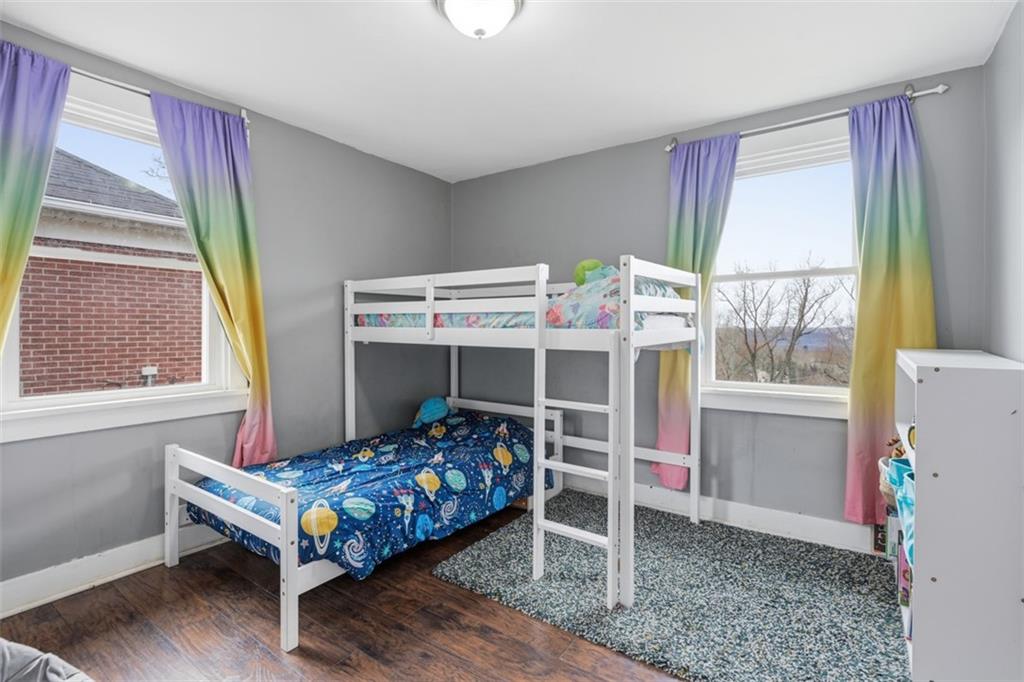 1414 Brinton Road Pittsburgh, PA 15221 - Photo 16 of 20 a bedroom with a bed and a window