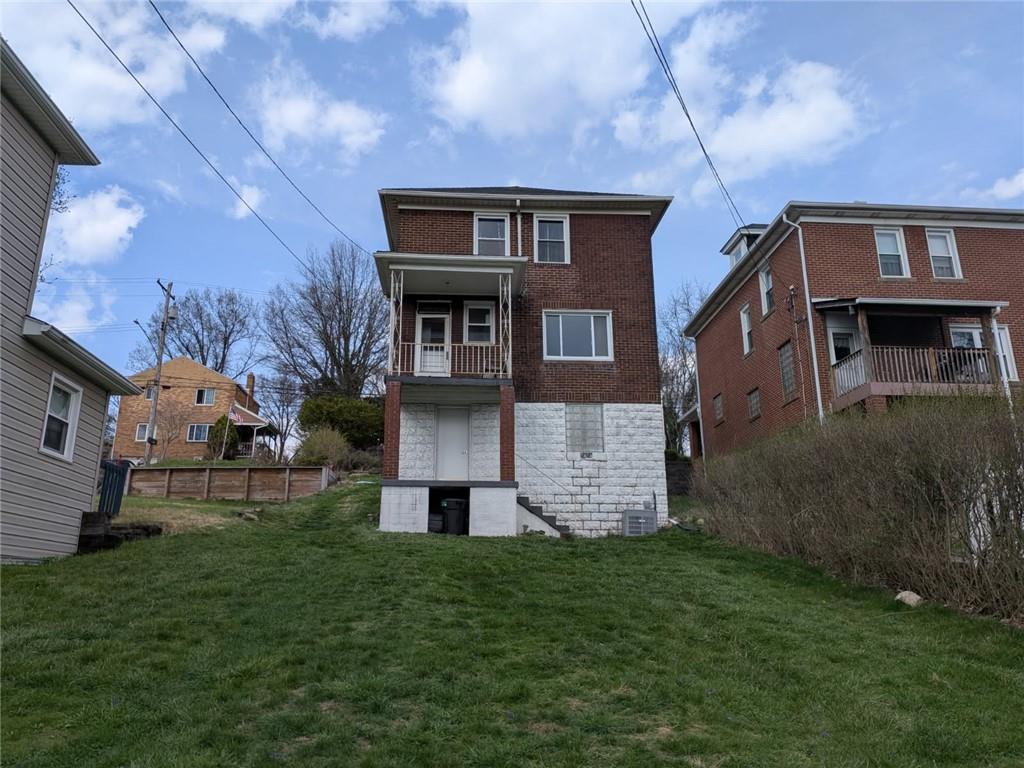 1414 Brinton Road Pittsburgh, PA 15221 - Photo 20 of 20 front view of house with a yard
