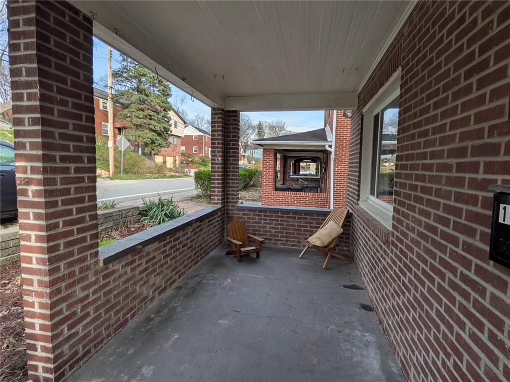 1414 Brinton Road Pittsburgh, PA 15221 - Photo 2 of 20 a room with stairs and a large window