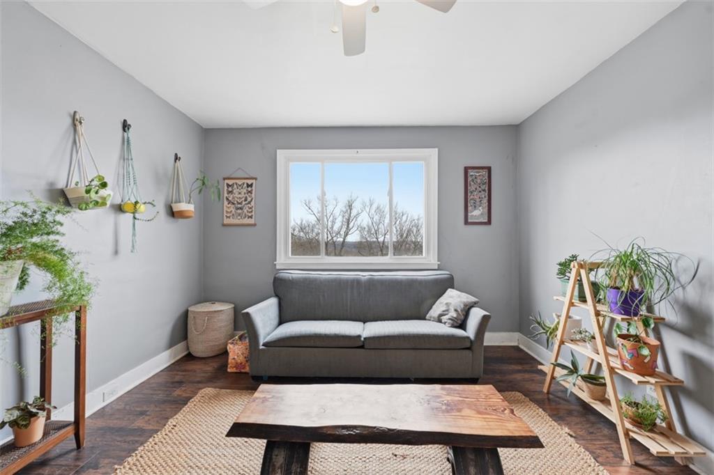 1414 Brinton Road Pittsburgh, PA 15221 - Photo 5 of 20 a living room with furniture a rug and a window