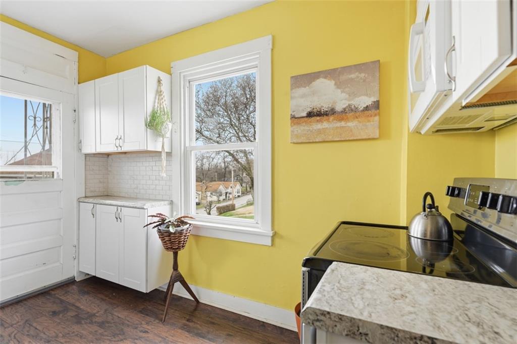 1414 Brinton Road Pittsburgh, PA 15221 - Photo 9 of 20 a view of a kitchen with fridge and a window