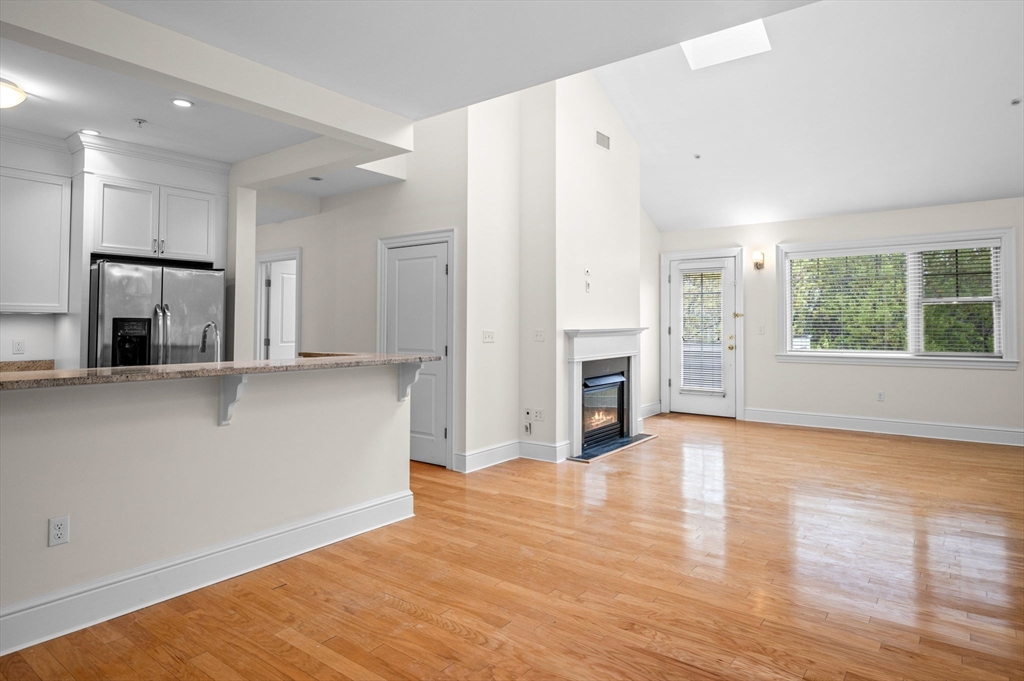 33 Intrepid Circle, Unit 405 Marblehead, MA 01945 - Photo 7 of 31 a view of a kitchen with wooden floor and a kitchen