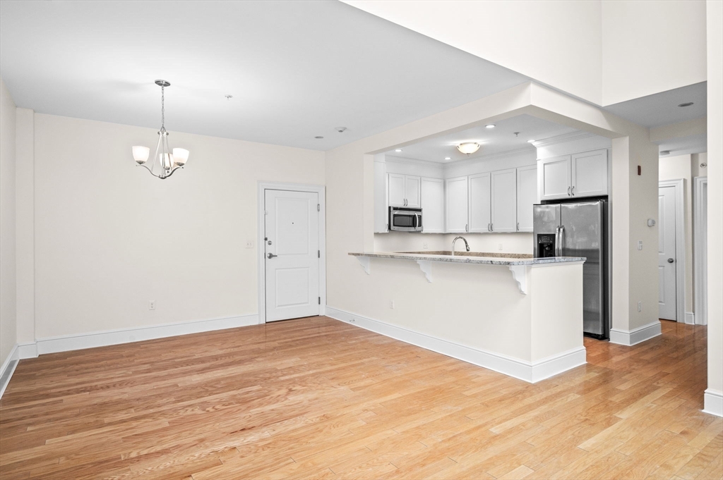 33 Intrepid Circle, Unit 405 Marblehead, MA 01945 - Photo 10 of 31 a view of kitchen with wooden floor