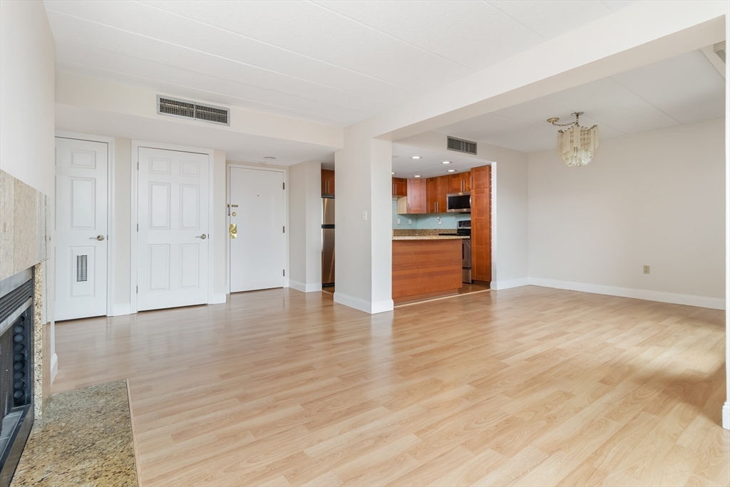 85 Brainerd Road, Unit 507 Boston, MA 02134 - Photo 7 of 23 a view of empty room with wooden floor