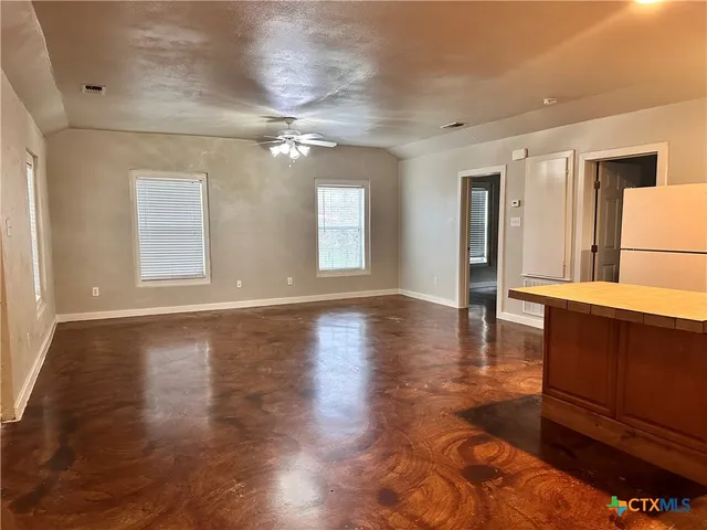 a view of a livingroom with wooden floor