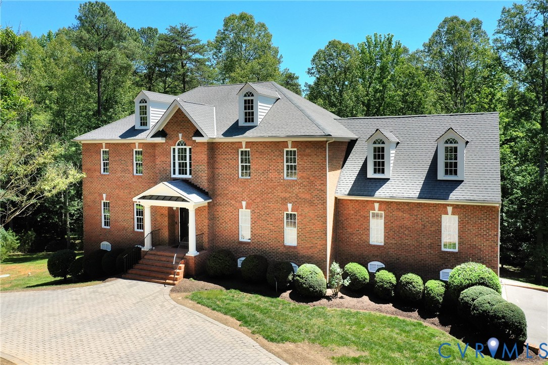 1295 Hermitage Road Manakin-Sabot, VA 23103 - Photo 2 of 55 a front view of a house with a yard and trees