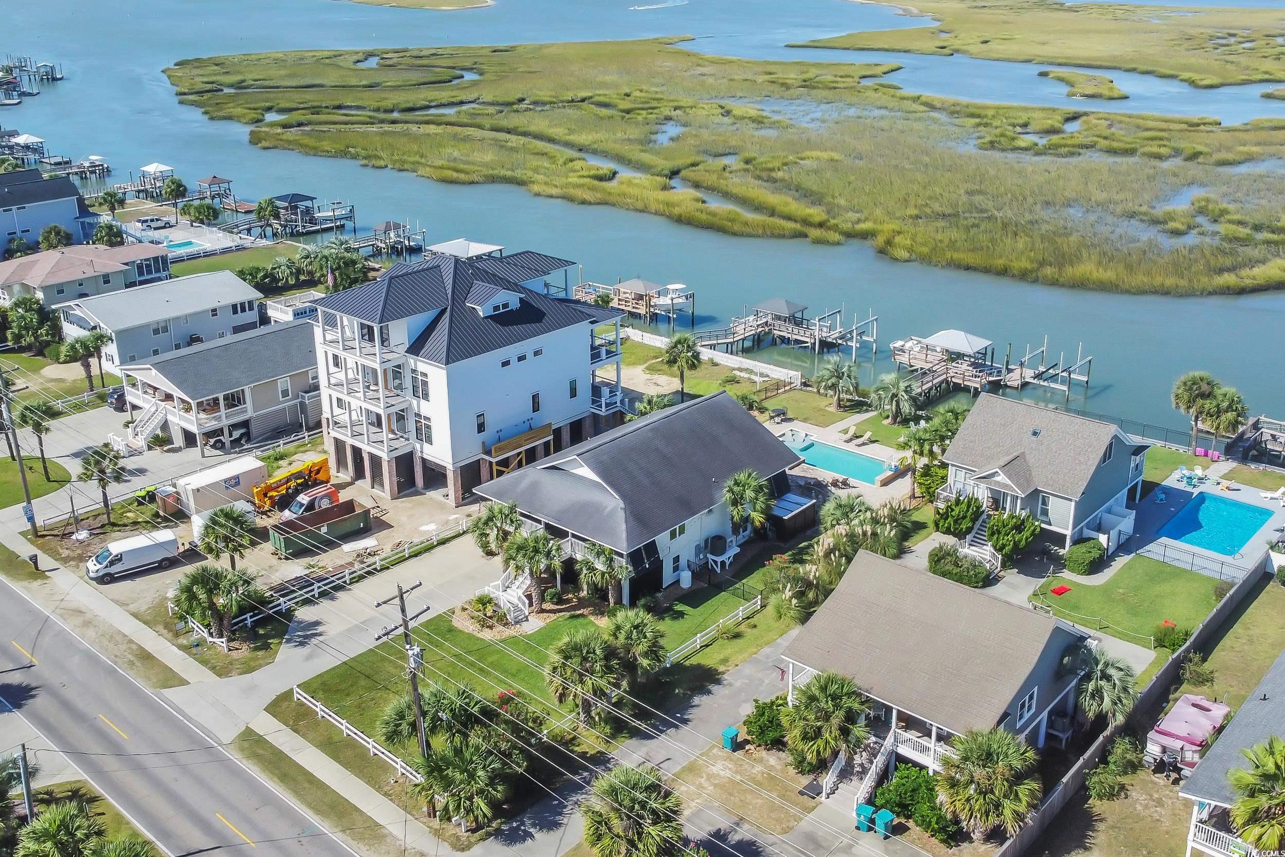 1332 South Waccamaw Drive Murrells Inlet, SC 29576 - Photo 21 of 39 Aerial view of residential area with a nearby body of water