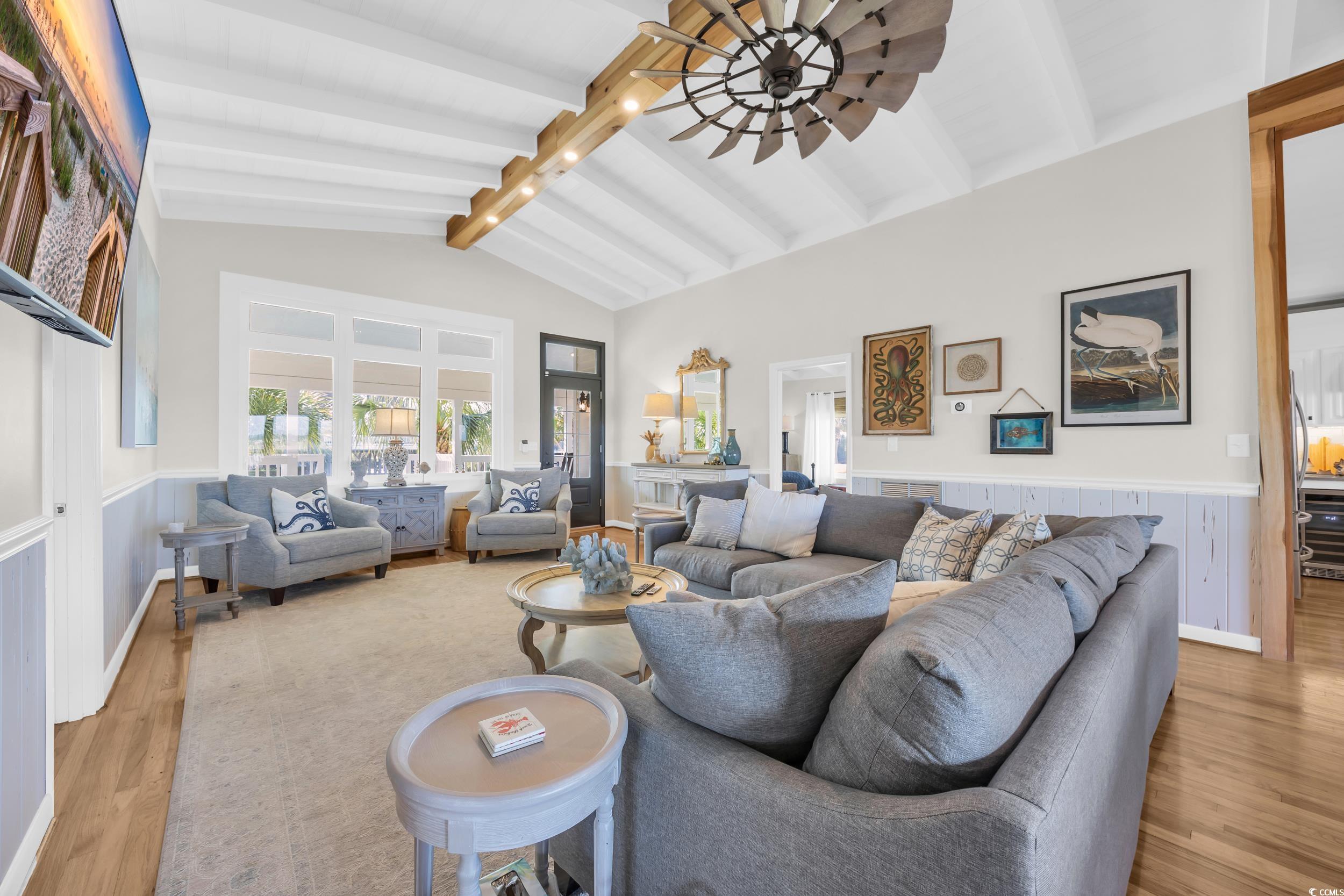 1332 South Waccamaw Drive Murrells Inlet, SC 29576 - Photo 25 of 39 Living room featuring wainscoting, light wood finished floors, and ceiling fan