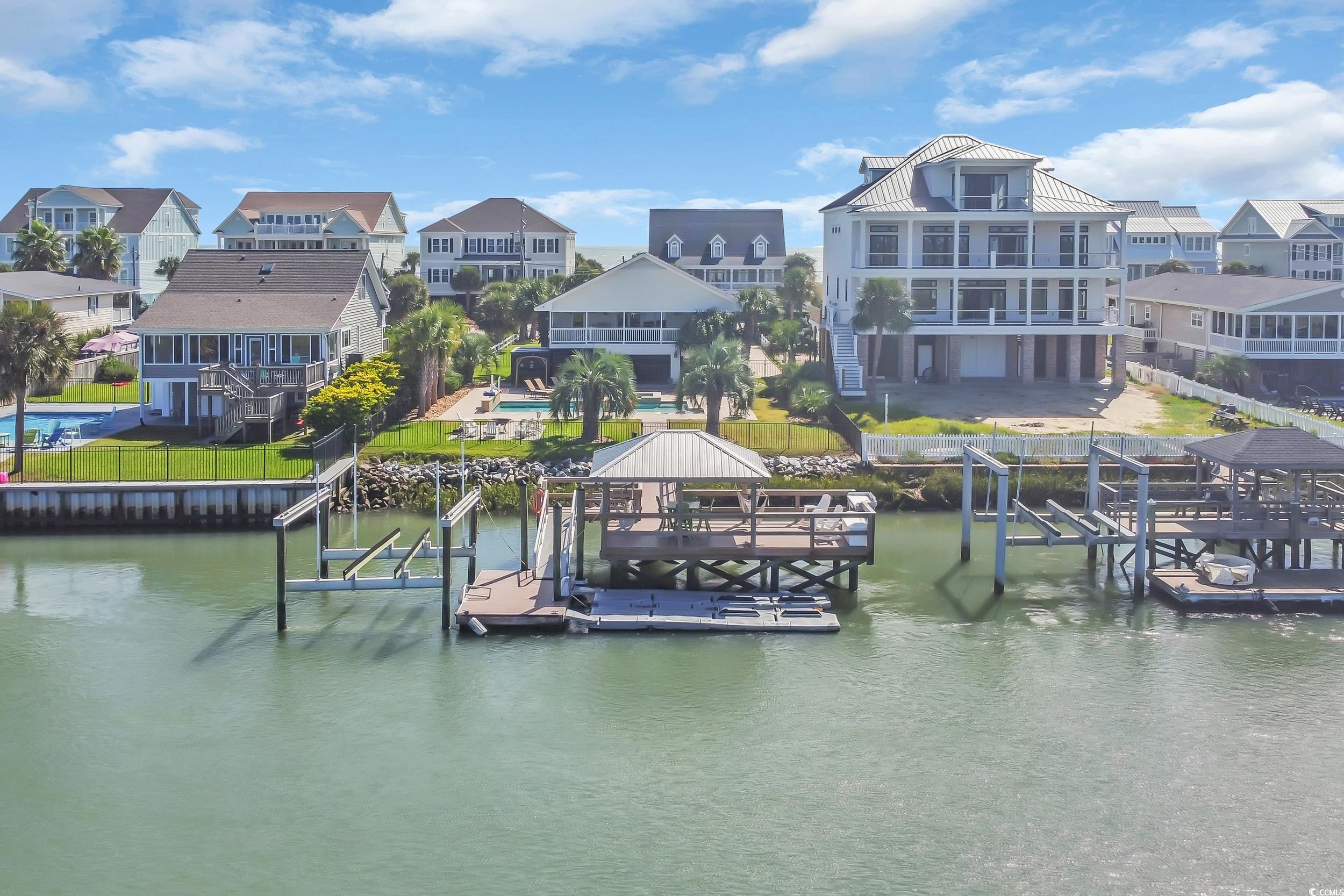 1332 South Waccamaw Drive Murrells Inlet, SC 29576 - Photo 3 of 39 Dock area with boat lift, a residential view, and a water view