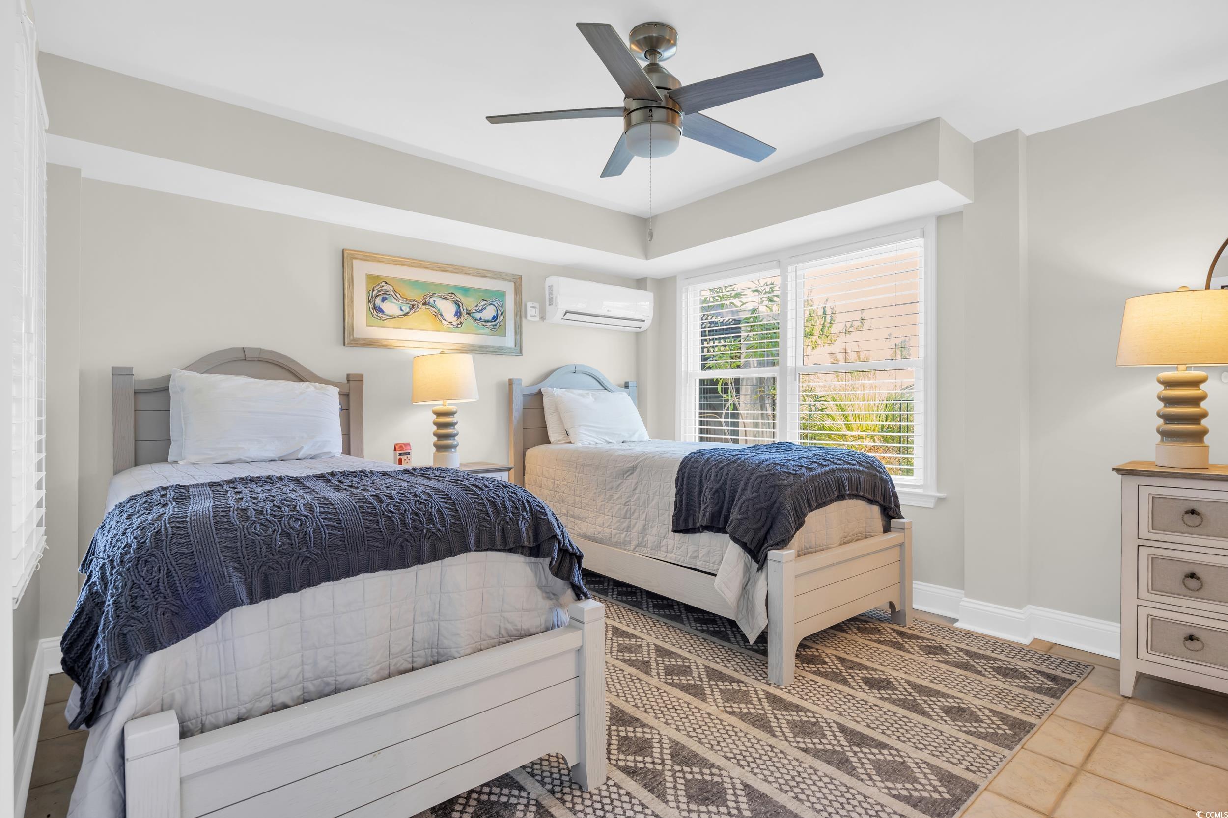 1332 South Waccamaw Drive Murrells Inlet, SC 29576 - Photo 37 of 39 Tiled bedroom featuring ceiling fan and a wall unit AC