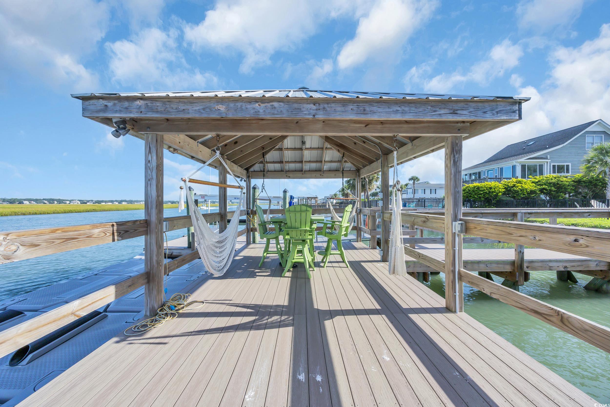 1332 South Waccamaw Drive Murrells Inlet, SC 29576 - Photo 8 of 39 Dock with a water view, boat lift, and a gazebo