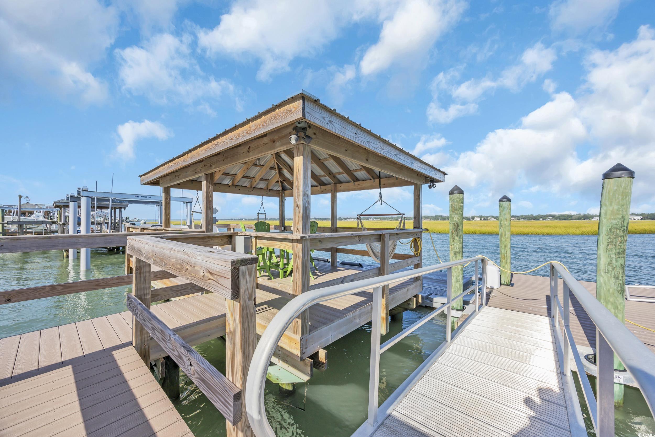 1332 South Waccamaw Drive Murrells Inlet, SC 29576 - Photo 9 of 39 Dock area with a water view and boat lift