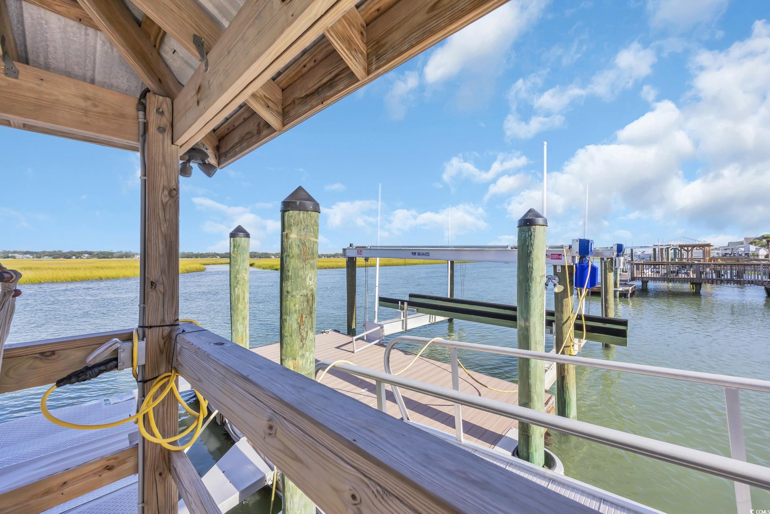 1332 South Waccamaw Drive Murrells Inlet, SC 29576 - Photo 10 of 39 Dock with boat lift and a water view