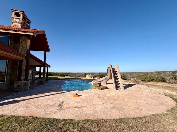 a view of a living room and floor to ceiling window