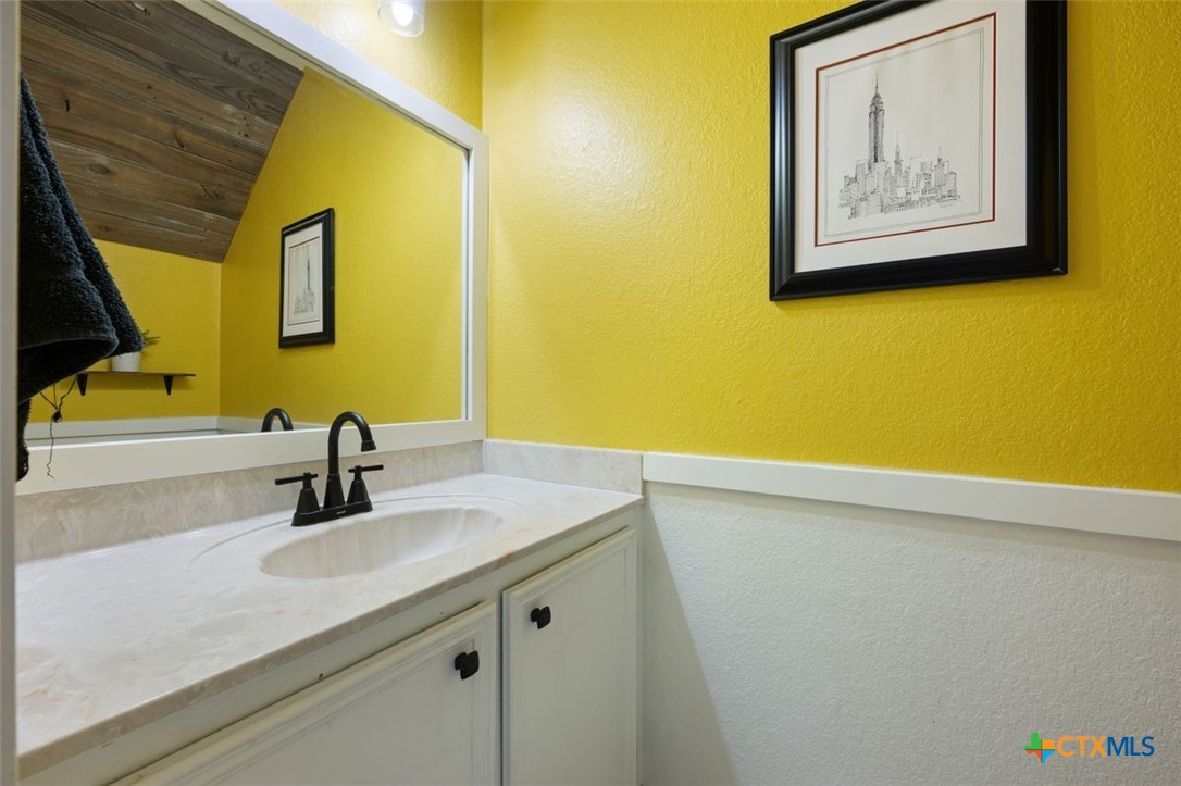 2307 Bernice Circle Copperas Cove, TX 76522 - Photo 17 of 32 a bathroom with a sink and a mirror