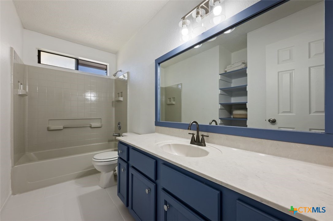 2307 Bernice Circle Copperas Cove, TX 76522 - Photo 27 of 32 a bathroom with a sink a toilet and shower