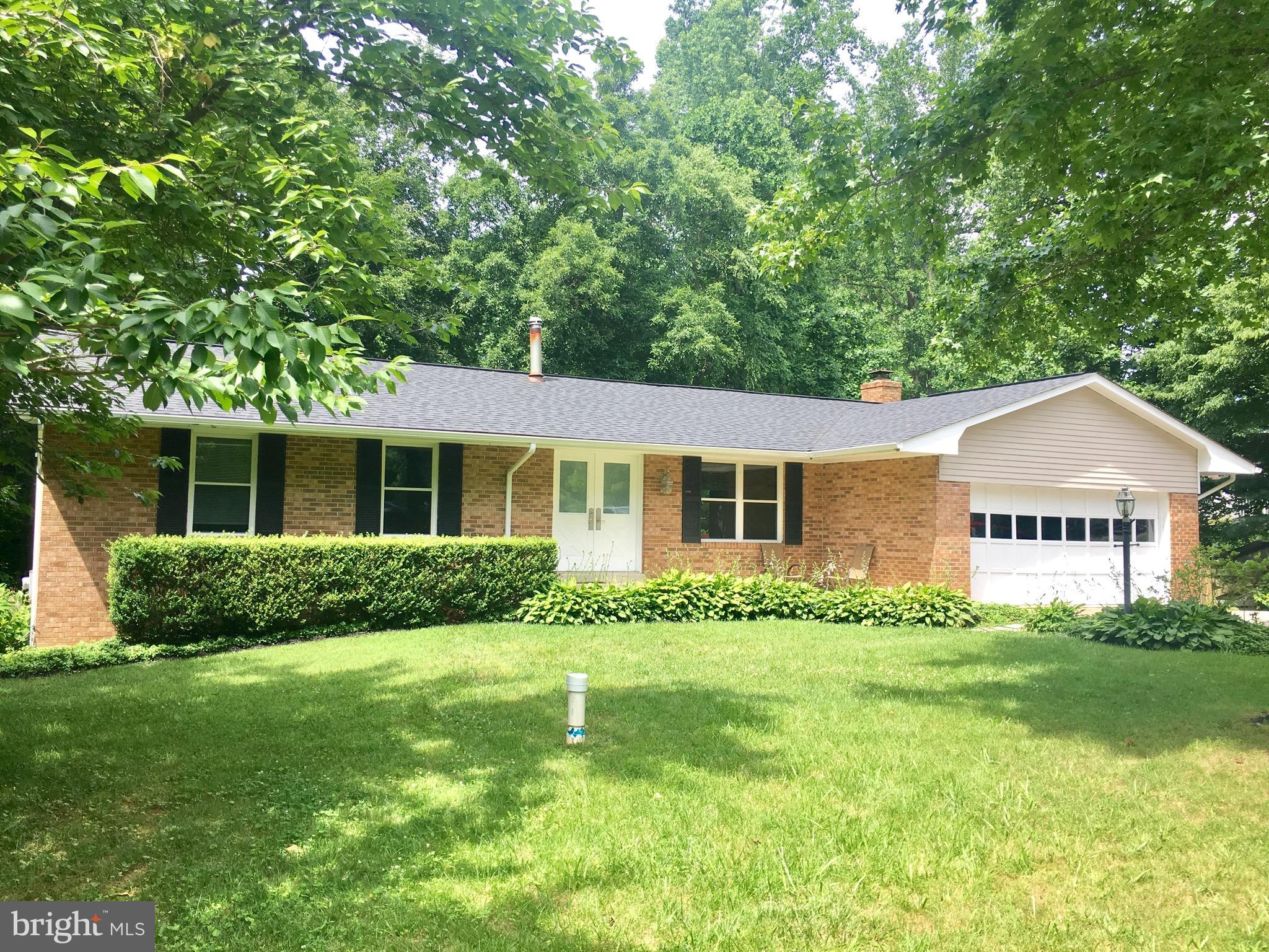 2616 Apple Way Dunkirk, MD 20754 - Photo 1 of 29 a front view of a house with a yard and green space