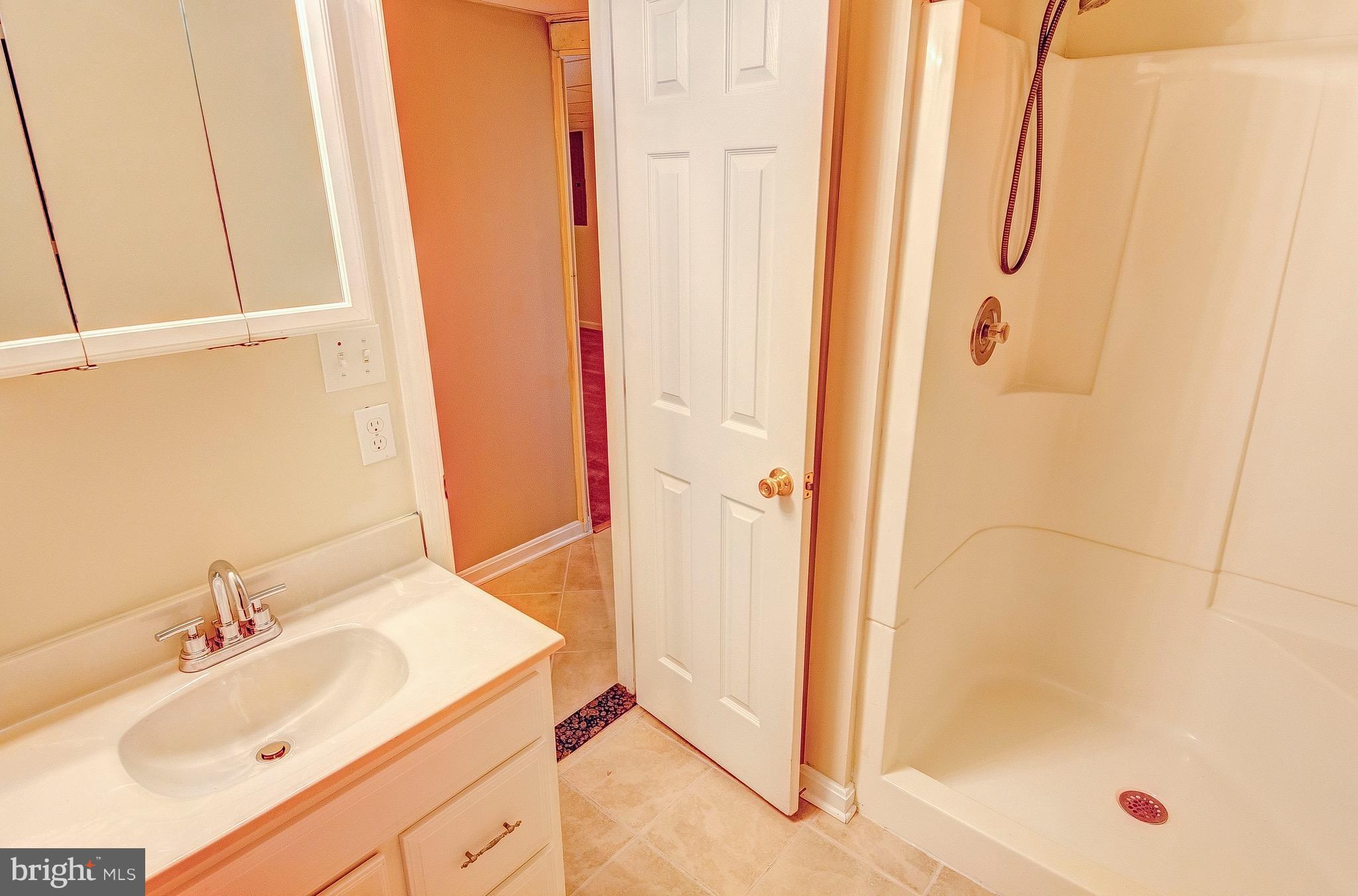 2616 Apple Way Dunkirk, MD 20754 - Photo 25 of 29 a bathroom with a sink and a shower