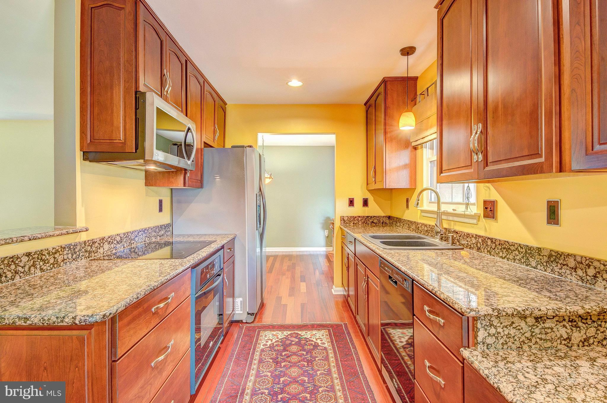 2616 Apple Way Dunkirk, MD 20754 - Photo 6 of 29 a kitchen with stainless steel appliances granite countertop a sink and a stove
