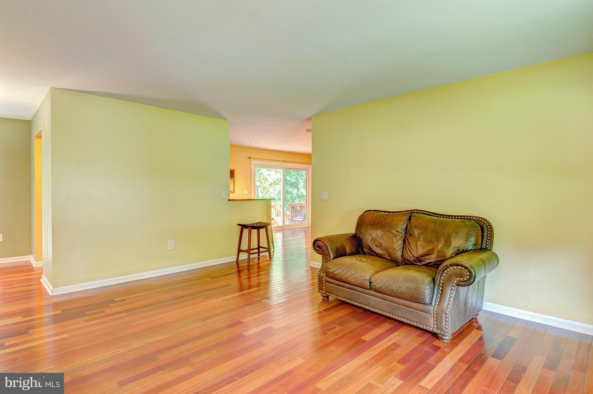 2616 Apple Way Dunkirk, MD 20754 - Photo 9 of 29 a living room with a couch and a wooden floor