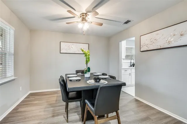 a view of a dining table and chairs in a room