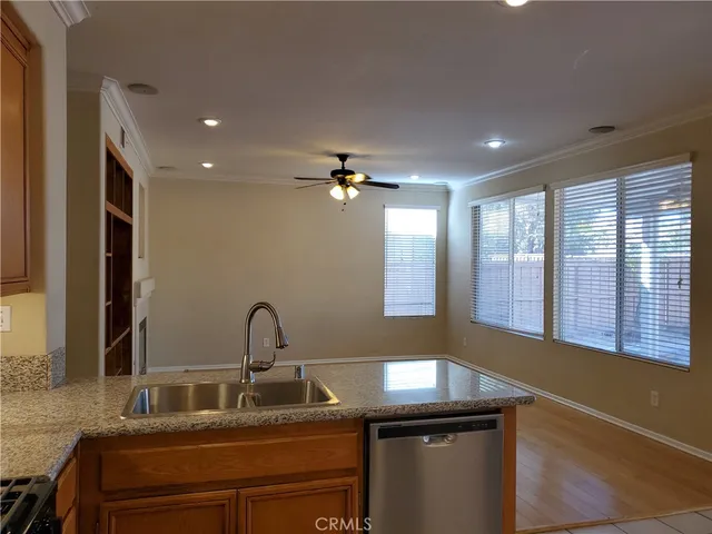 a kitchen with a sink and a window