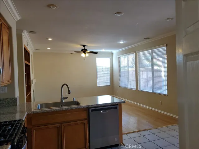 a kitchen with a sink and chandelier