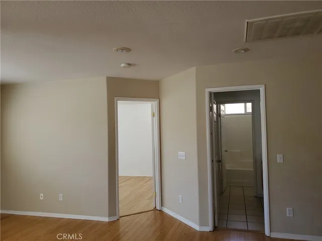wooden floor and closet in a room