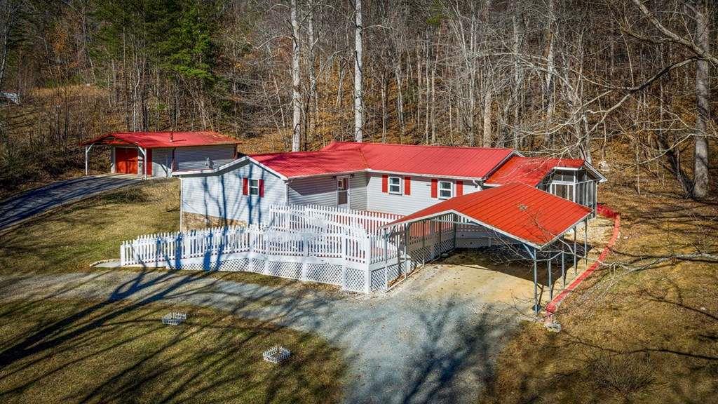 118 Jordan Road Blairsville, GA 30512 - Photo 39 of 49 an aerial view of a house with swimming pool and red chairs