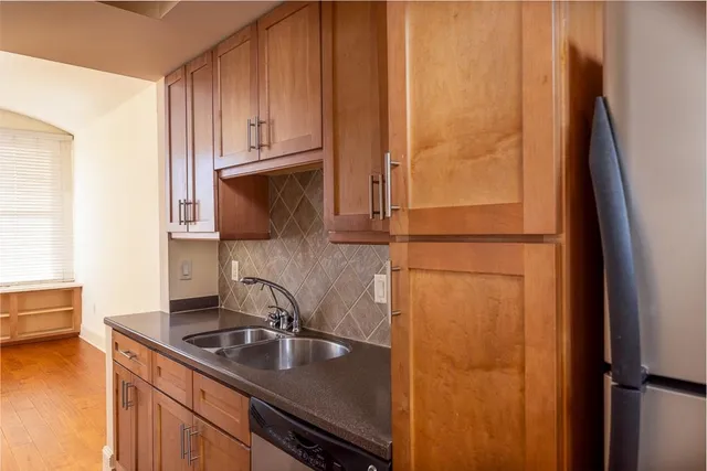 a kitchen with a sink and cabinets