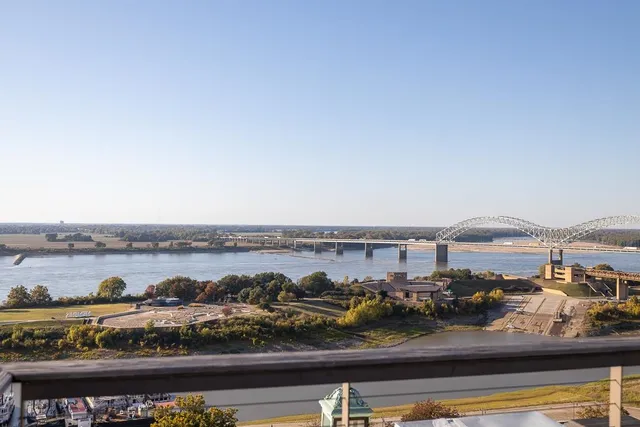 a view of a room with wooden floors and wooden floor
