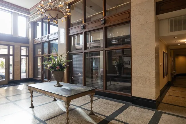 a table and chairs in front of a building