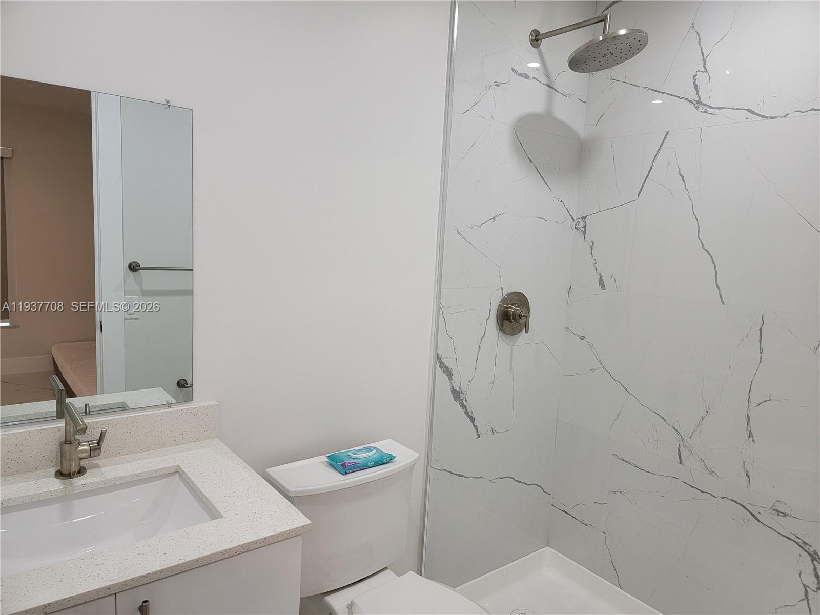 14860 Southwest 307th Street Homestead, FL 33033 - Photo 11 of 14 a bathroom with a sink toilet and shower