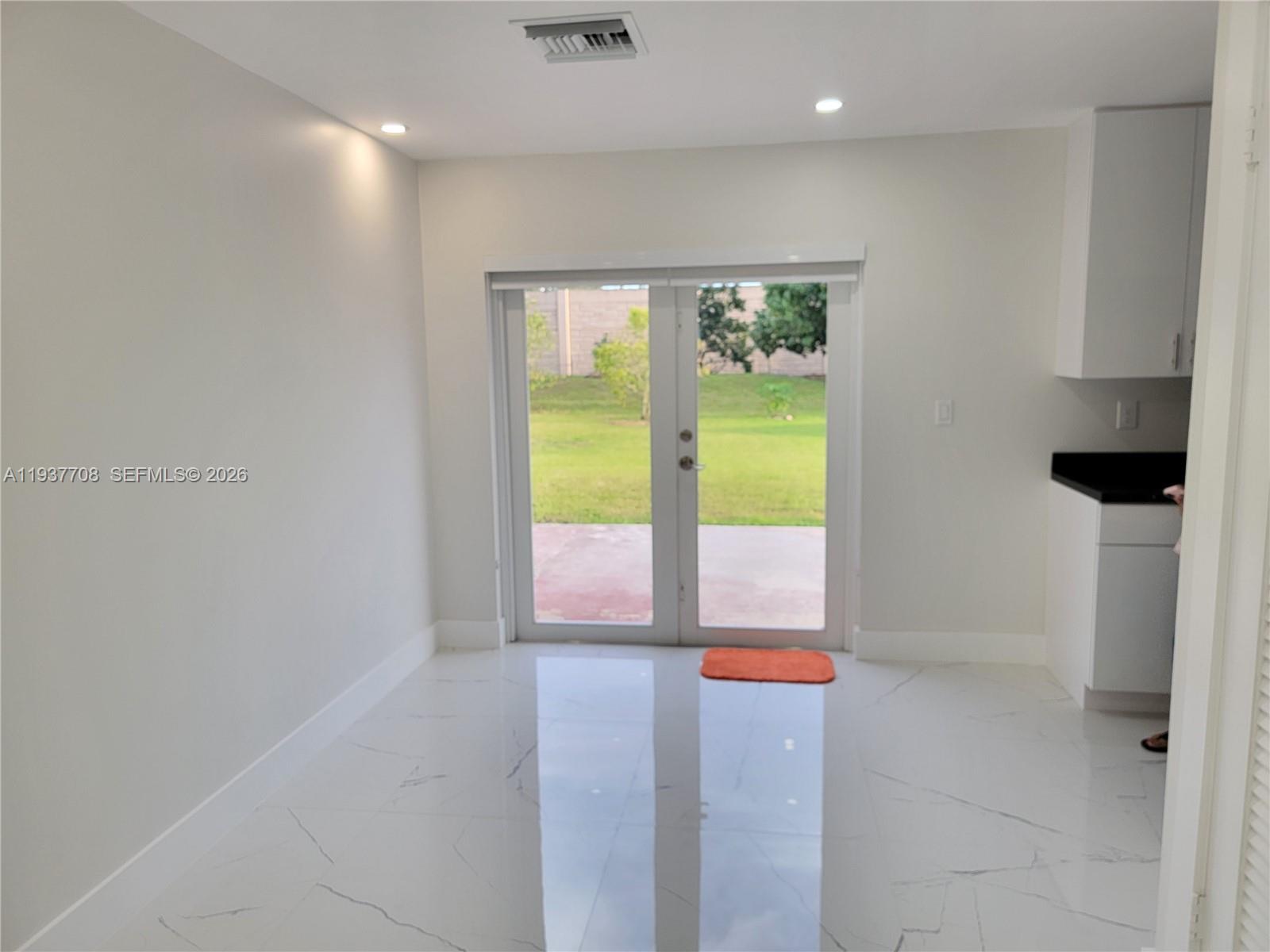 14860 Southwest 307th Street Homestead, FL 33033 - Photo 13 of 14 a view of an empty room with a window