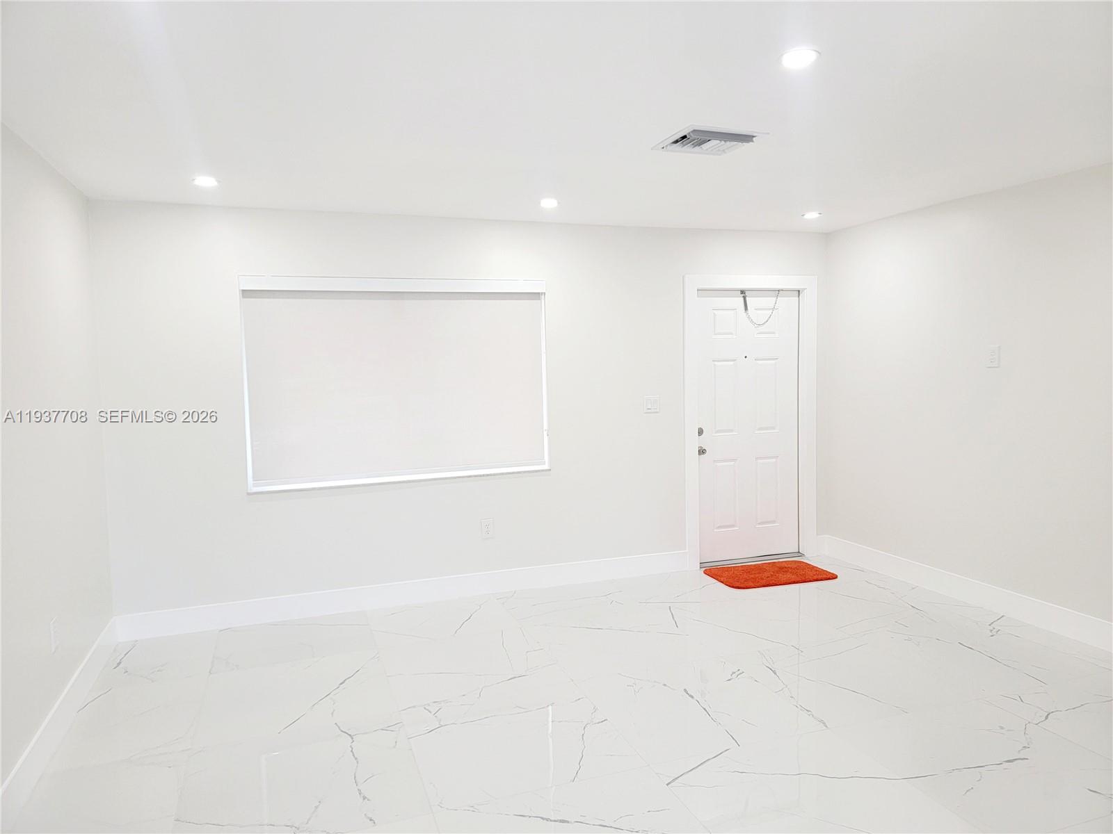 14860 Southwest 307th Street Homestead, FL 33033 - Photo 5 of 14 a view of a room with rack on the wall