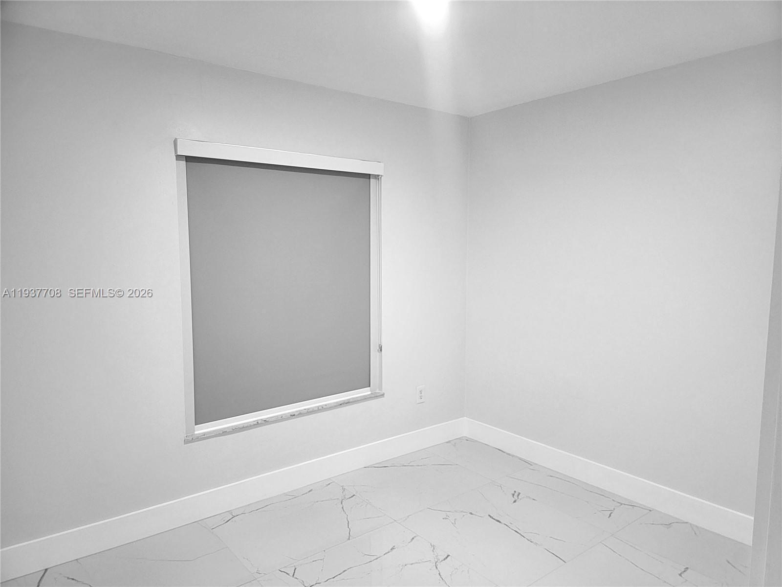 14860 Southwest 307th Street Homestead, FL 33033 - Photo 7 of 14 a view of an empty room