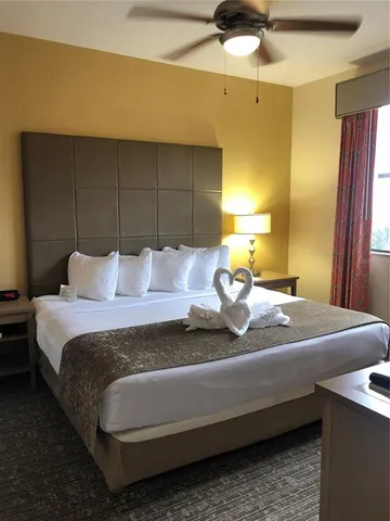 a bedroom with bed and window