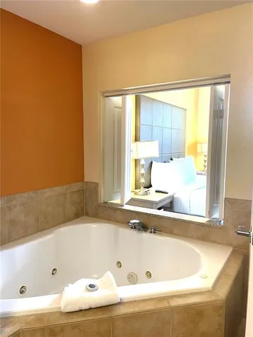 a bath tub sitting next to a window
